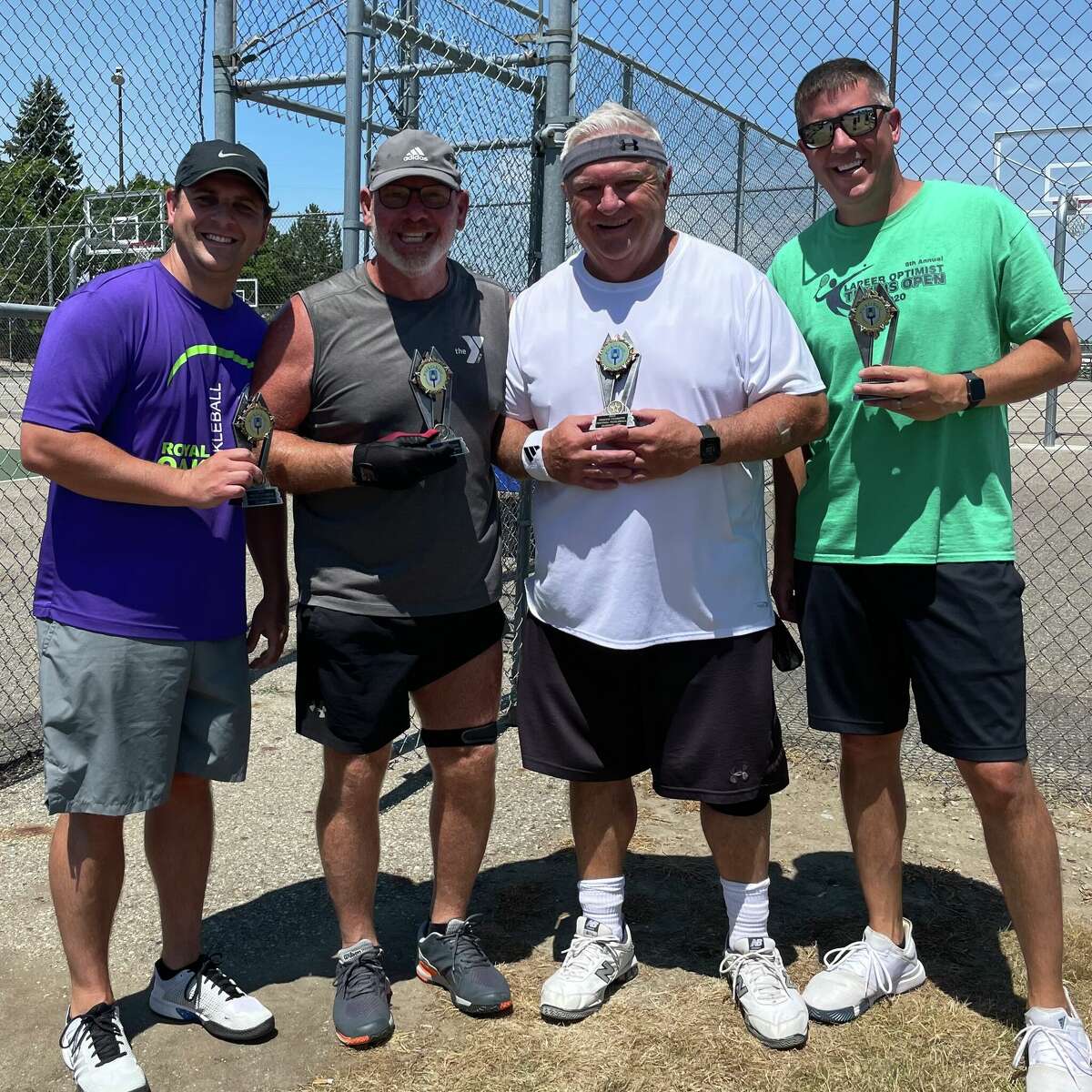 The pickleball tournament champions, Ed Belcrest and Steve Krankoto, along with the runners-up, Kent and Lance Tibbits.