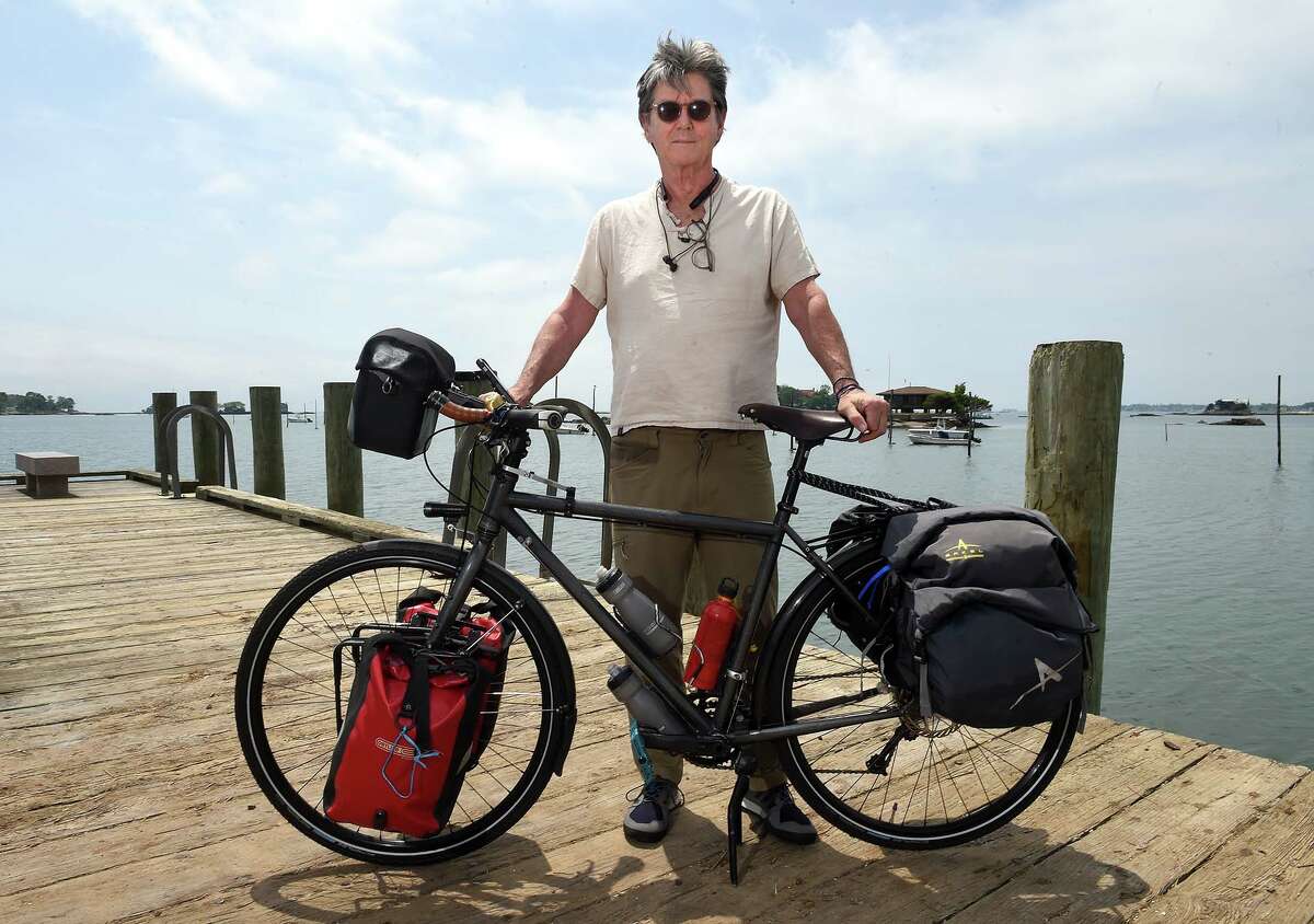 Robert Reynolds with his touring bicycle at the Stony Creek dock near his home in Branford in late May, shortly before departing for another overseas adventure.