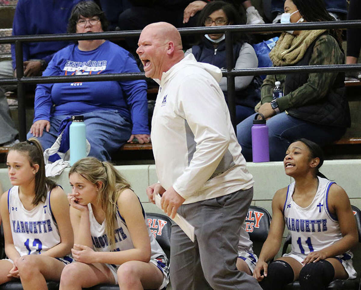 Marquette Catholic coach Lee Green instructs his team during a Class 2A sectional semifinal against Carthage Illini West last season in Waverly. Green is the 2022 Telegraph Small-Schools Girls Basketball coach of the year.