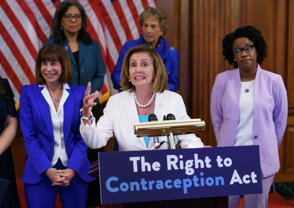 Speaker of the House Nancy Pelosi, D-Calif., makes a point during an event with Democratic women House members and advocates for reproductive freedom ahead of the vote on the Right to Contraception Act, at the Capitol in Washington, Wednesday, July 20, 2022. She is flanked by Rep. Kathy Manning, D-N.C., and Rep. Lauren Underwood, D-Ill. (AP Photo/J. Scott Applewhite)