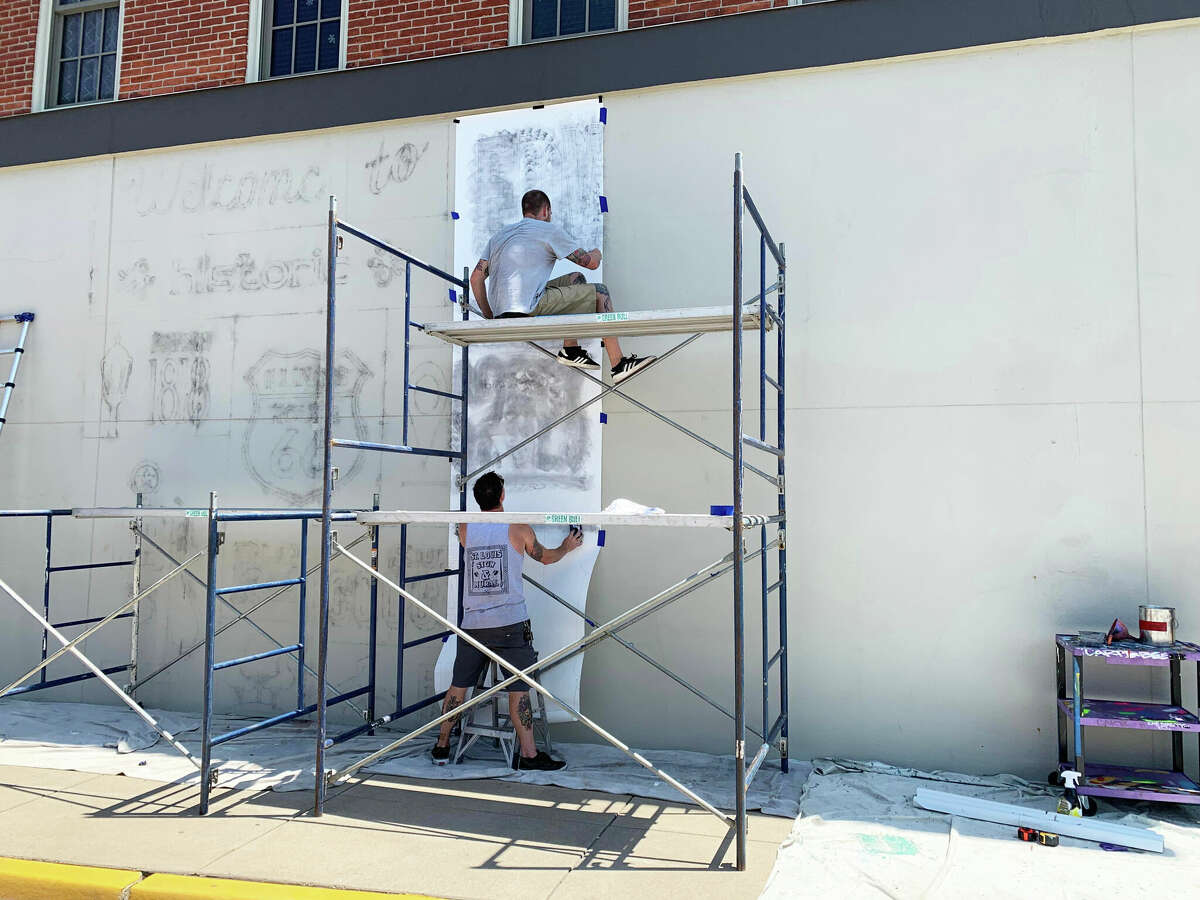 Progress on the Route 66 mural at the southwest corner of West Vandalia and South Main streets began on Thursday. It's a near week-long process. 