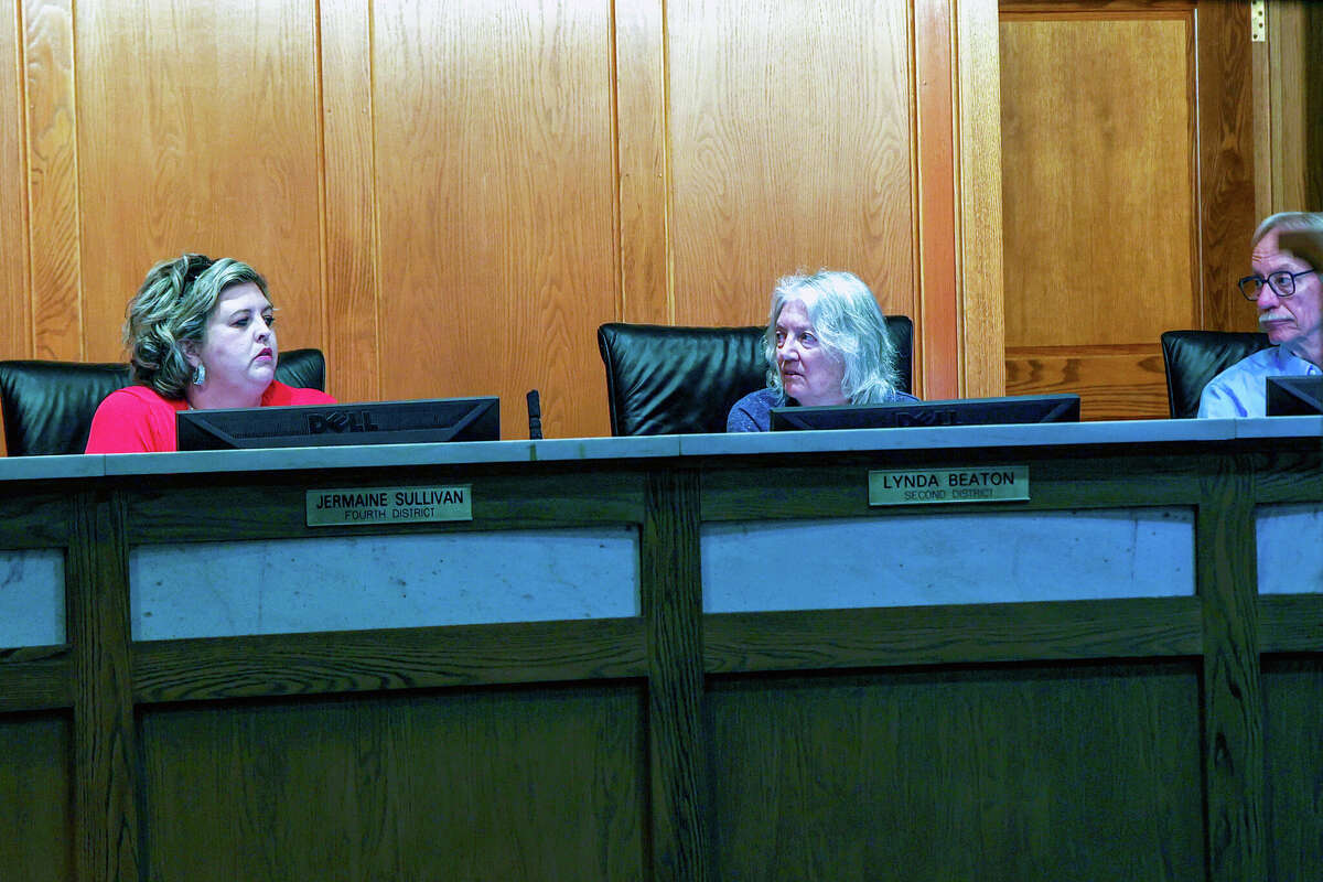 From left: Manistee City Council members Jermaine Sullivan, Mayor Lynda Beaton and Mick Szymanski discuss a purchase agreement for software that could properly identify how many short-term rentals exist within the city of Manistee. The resolution was ultimately voted down a majority of the council.