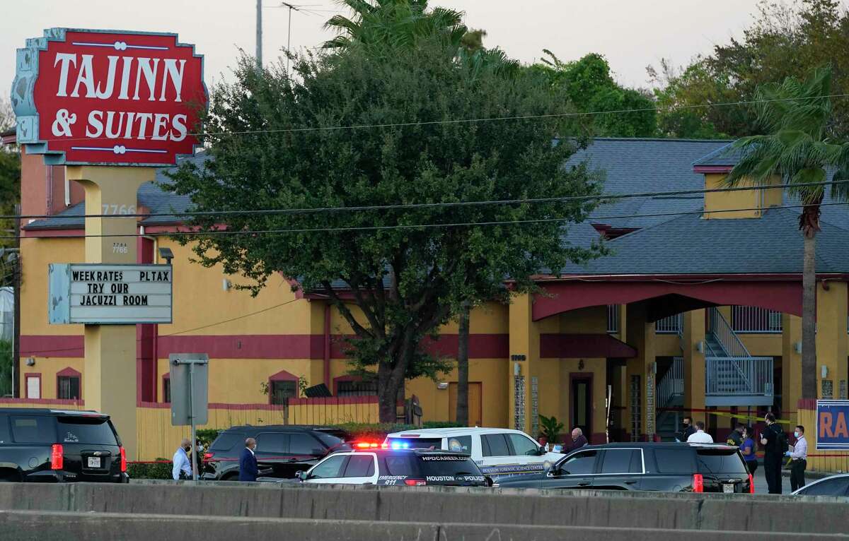 Police personnel and others are shown outside the Taj Inn and Suites, 7766 North Fwy., near where a Houston Police Dept. Sgt. Sean Rios was fatally shot Monday, Nov. 9, 2020 in Houston. Sgt. Rios, 47, a 25-year veteran with HPD, ran into the motel for help but he died in the lobby.