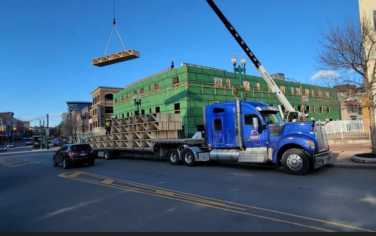 One of Magnet's trucks hauls flatbed loads, which often go to industrial or construction sites such as this one in Schenectady.