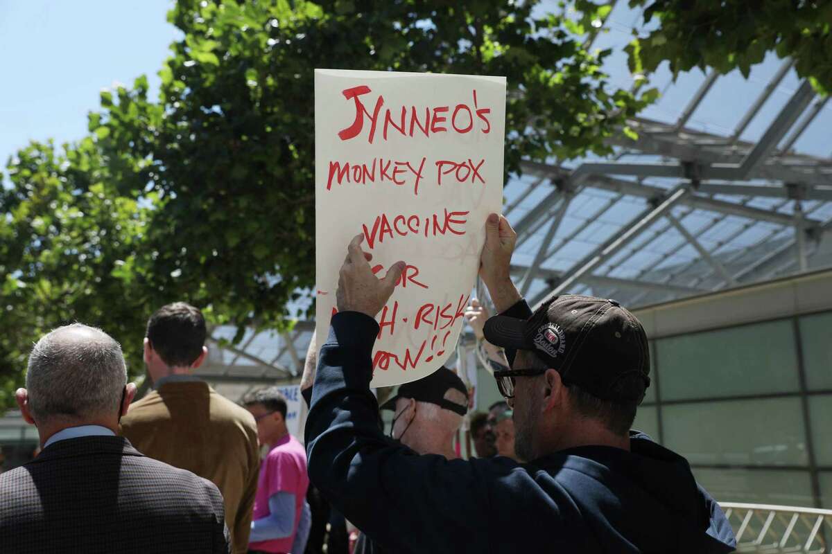 Brian Springfield of San Francisco holds a sign advocating for the Jynneo’s monkeypox vaccine as he demonstrates outside the San Francisco Federal Building on Monday, July 18, 2022.