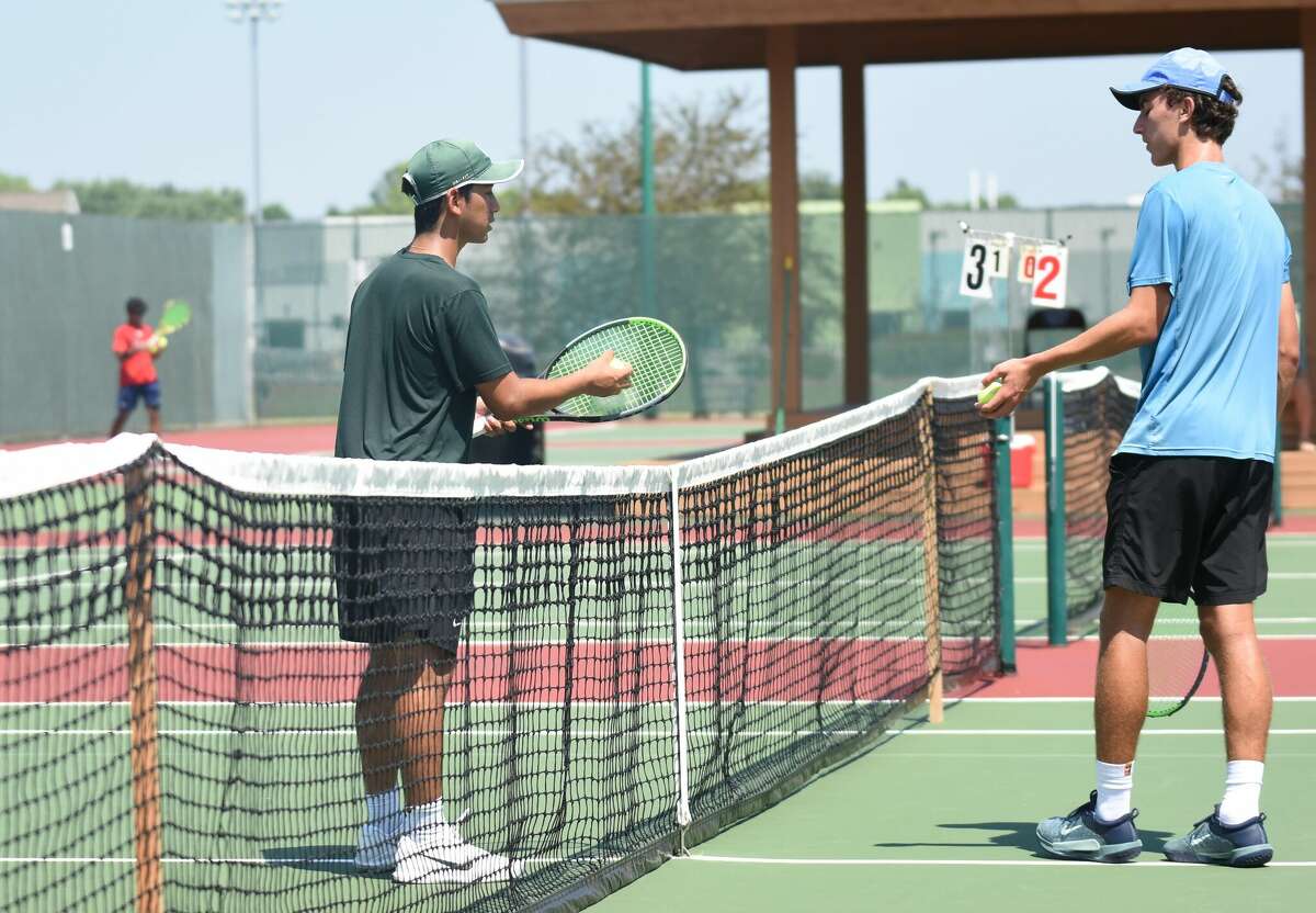 Josh Portnoy, left, discusses a point with Danny Radke during their first-round match of the Pro Wildcard Challenge on Thursday at the EHS Tennis Center. Portnoy won 6-3, 6-2 to advance to the quarterfinals on Thursday evening. The semifinals and championship match will be played Friday. Portnoy was one of 14 players to sign up for the tournament, which will provide a wildcard berth for the winner into the USTA Edwardsville Futures.