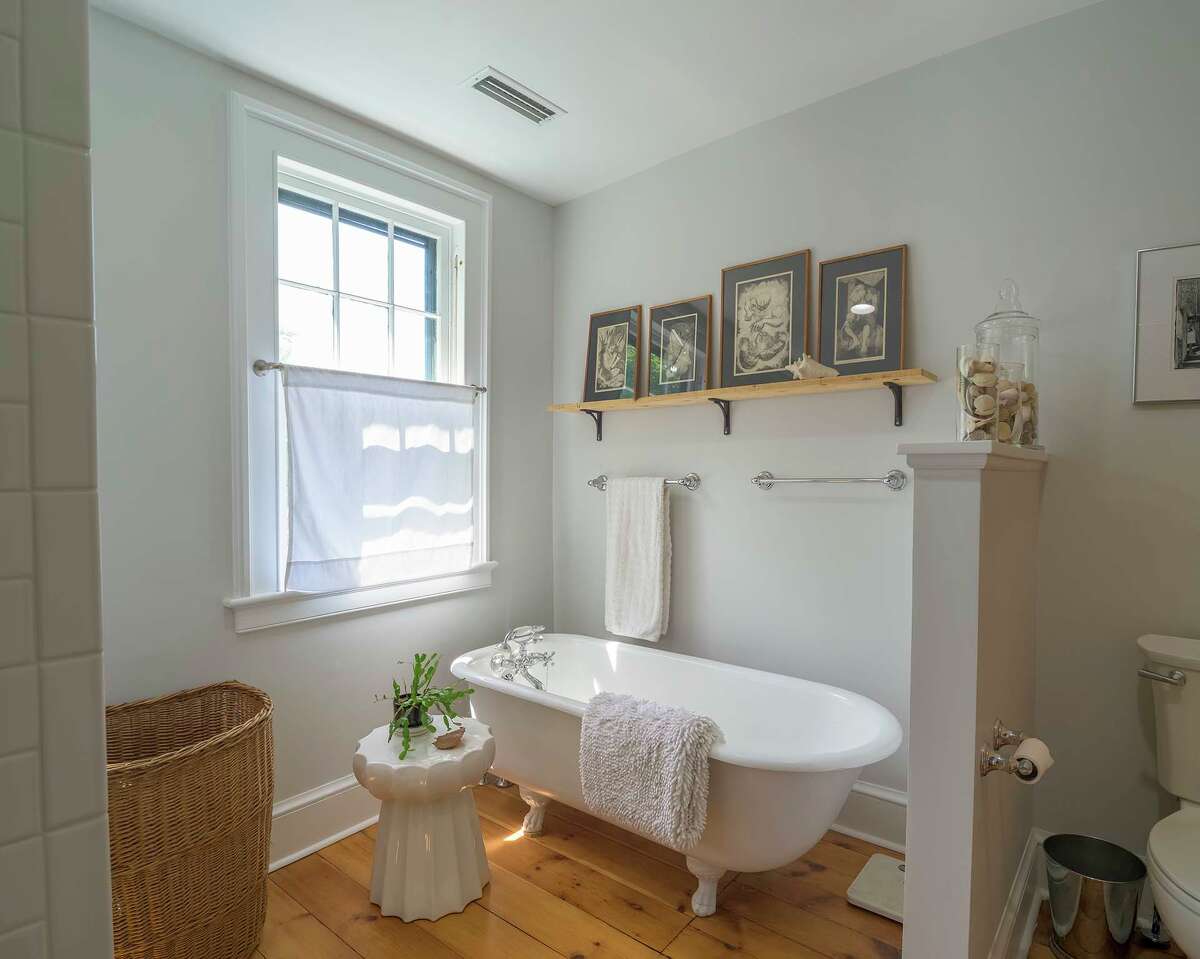 Formerly located on the second floor, a claw-foot tub was moved to the third-floor master bath. 