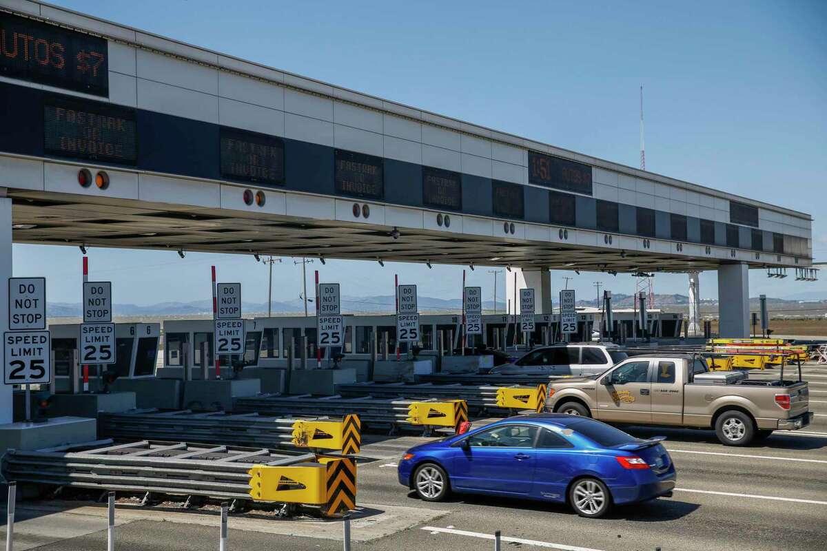 Cars drive through the Bay Bridge Toll lanes in Oakland, Calif. on April 11, 2022.