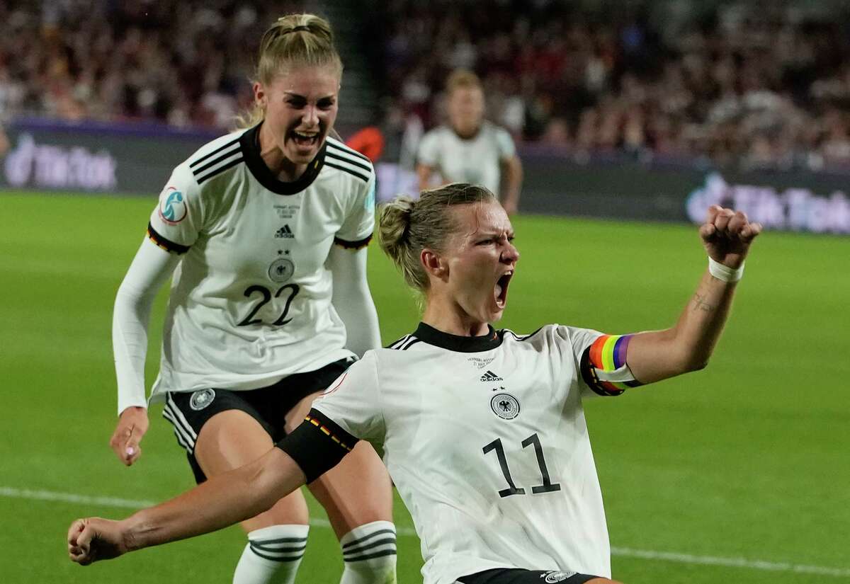 Alexandra Popp celebrates with Jule Brand (22) after scoring Germany’s second goal in a 2-0 victory over Austria in London.
