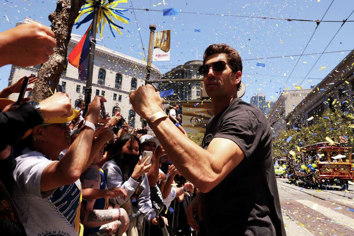Bob Myers, general manager of the Golden State Warriors, greets fans during the 2022 NBA Champion Golden State Warriors Parade on Monday, June 20, 2022, in San Francisco, Calif. This is the Warriors?• fourth NBA Championship in eight years.