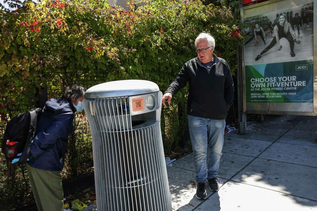 Van Fendyan (right) says the a new trash can at Geary Boulevard and Divisadero Street “looks like a little robot — like R2D2.”