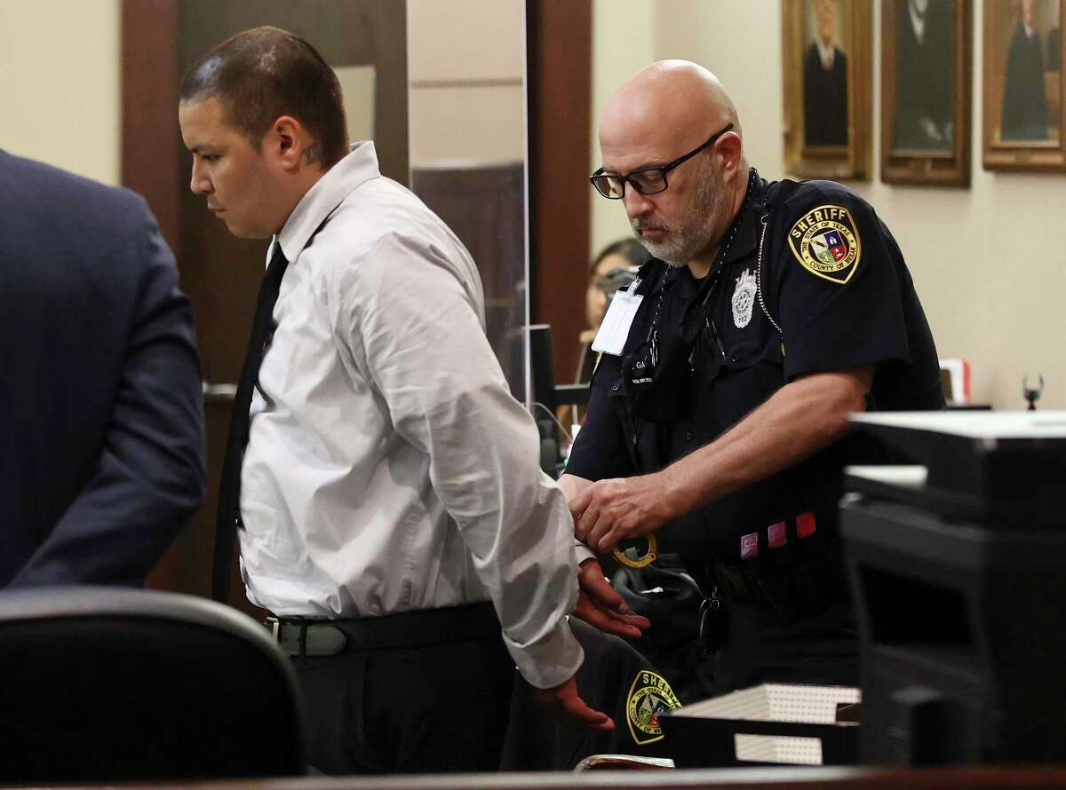 A Bexar County Sheriffs Department Bailiff places handcuff on David James Estrada after the jury returns a guilty verdict late Thursday, July 21, 2022 in his murder trial which accused him of running over his ex-wife, Dominga Irene Pesqueda Estrada, 33, on Sept. 5, 2020. After telling police and detectives someone in a black pickup ran her down, he confessed that he tried to scare her when he chased her with his pickup, and hit her when she went in the opposite direction in which he thought.