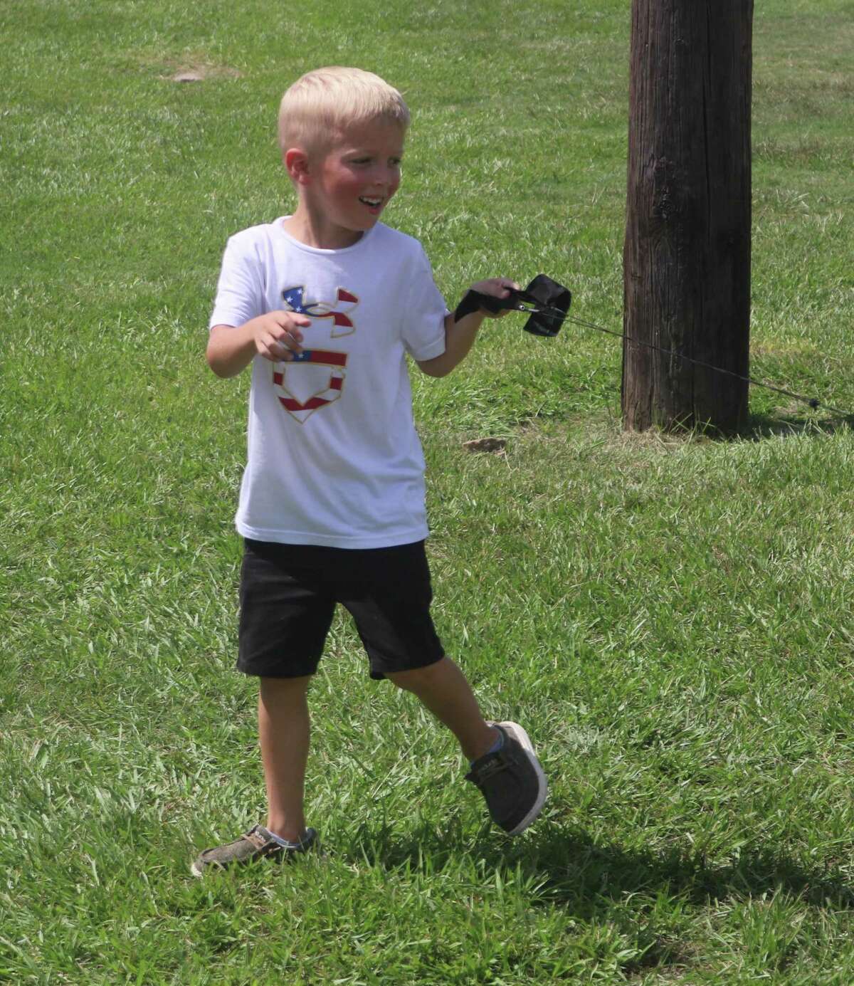 Ripkin Desadier delights playing with a baseball on a string at the Ruth Minchen Athletic Complex Thursday.  Ripkin is the 6-year-old brother of Deanville all-star second baseman Tavin Desadier.