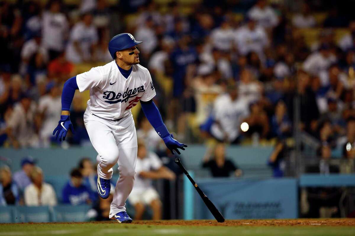 LOS ANGELES, CALIFORNIA - JULY 21: Trayce Thompson #25 of the Los Angeles Dodgers hits a rbi triple against the San Francisco Giants in the eighth inning at Dodger Stadium on July 21, 2022 in Los Angeles, California. (Photo by Ronald Martinez/Getty Images)
