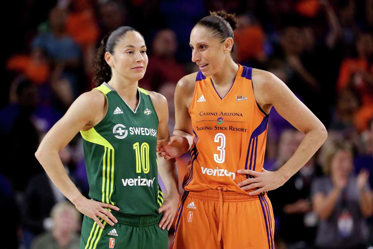 Phoenix Mercury guard Diana Taurasi (3) talks with Seattle Storm guard Sue Bird during the second half of a WNBA playoff game in Tempe, Ariz., in 2017.