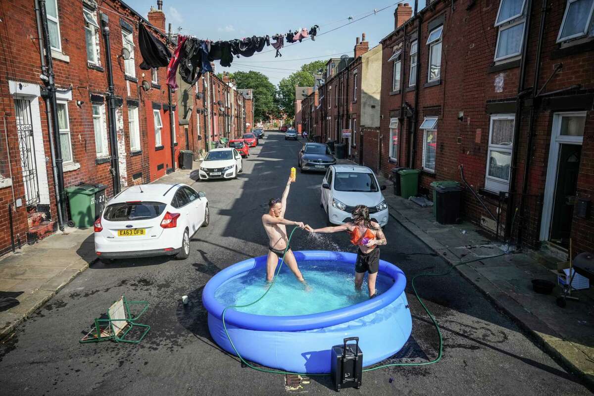 Residents of Leeds, England, cool off last week. The changing climate has business leaders mobilizing to create businesses that make money saving the planet. Think what that could mean for Texas.