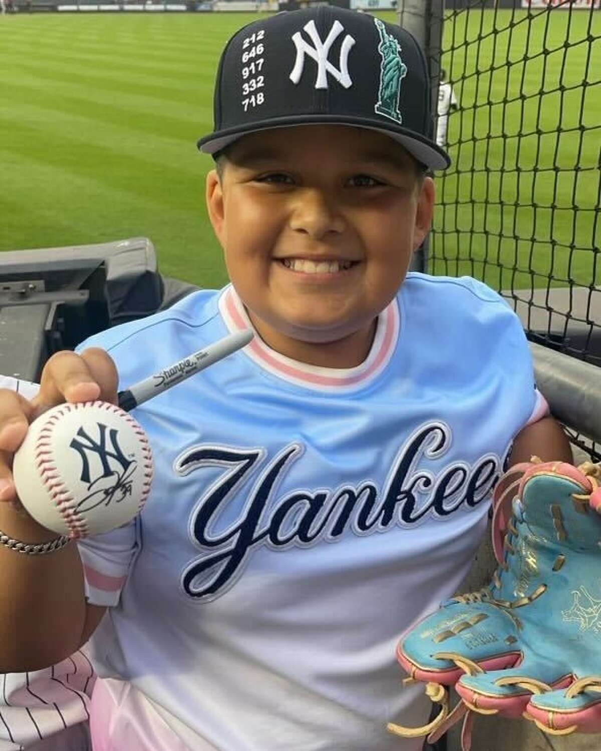 Gio Luna with a signed ball from his hero Jose Trevino.