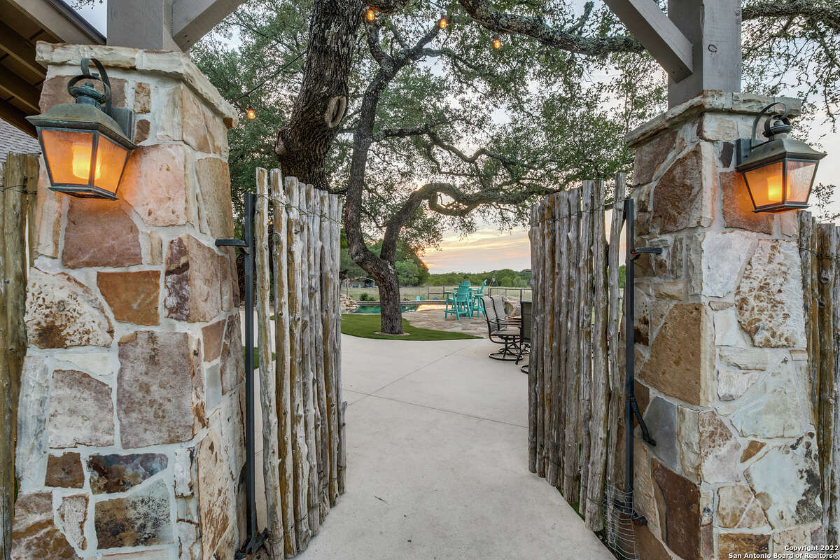 A home in Fair Oaks Ranch near Boerne features an AstroTurf backyard and chicken coop