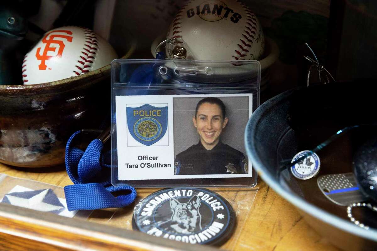 Photos and memorabilia honoring Tara O’Sullivan, a former Sacramento police officer who died in the line of duty in 2019, at her parents’ home in the Contra Costa County community of Briones. Her parents were inspired to rent their property to dog owners by their daughter, who loved dogs and hoped to become a canine officer.