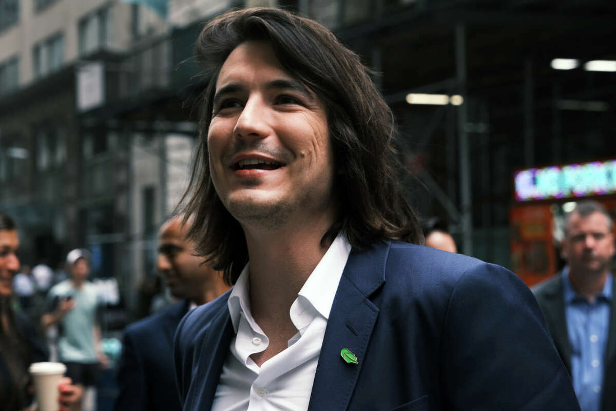 Vlad Tenev, CEO of Robinhood, walks along Wall Street after going public with an IPO earlier in the day on July 29, 2021, in New York. 