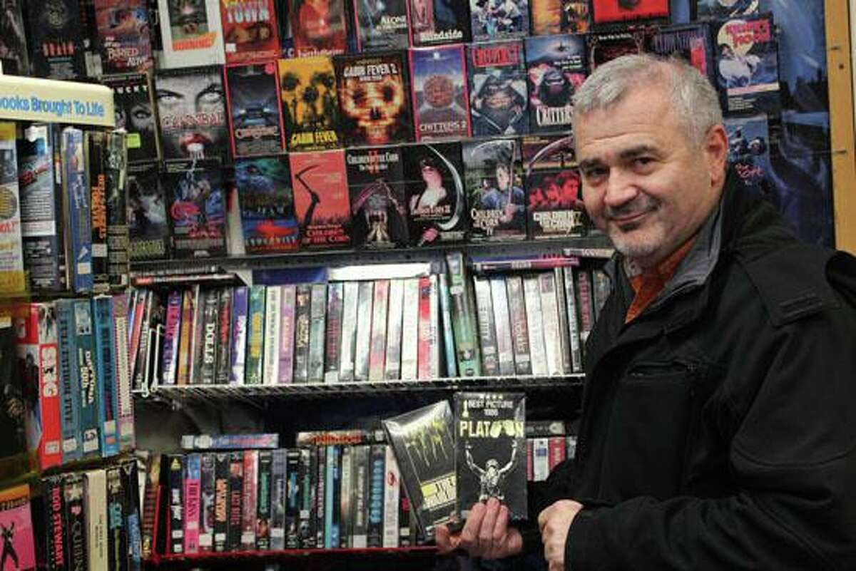 Robert Achille, owner of Video 7 on Kneen Street, pictured inside the store in 2016. Achille, 64, a lifelong Shelton resident and owner of the iconic Video 7 for more than three decades, died July 15 at Yale New Haven Hospital.