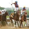 ELMONT, NEW YORK - JUNE 11: Mo Donegal with Irad Ortiz, Jr. up wins the 154th running of the Belmont Stakes as Nest with Jose Ortiz up finishes second at Belmont Park on June 11, 2022 in Elmont, New York.