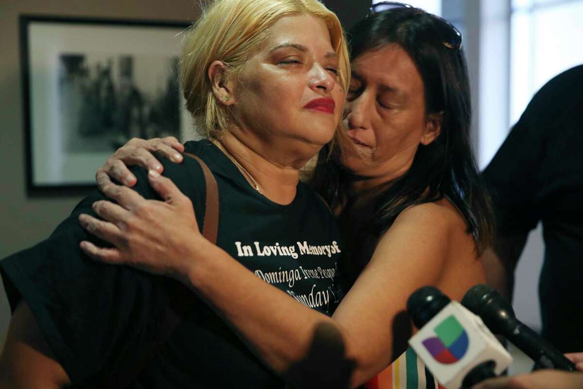 Christie Balderas, left, and Michelle Briseno react after their sister’s killer, David James Estrada Jr., is sentenced to 15 years in prison Friday. He was found guilty of murder the day before for killing his ex-wife, Dominga Irene Pesqueda Estrada, 33, in 2020.