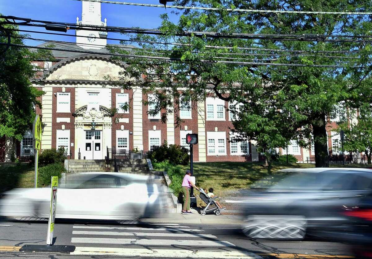 Cars pass by in the front of Stamford High School along Strawberry Hill Avenue on July 13. Among Stamford schools, Stamford High School has the highest rate of traffic accidents and traffic stops over the last three years. In 2016, 18-year-old Karina Tinajero-Arreguin was killed when she was hit by a van while crossing Strawberry Hill Avenue to get to the school.