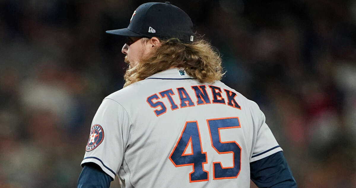 Houston Astros pitcher Ryne Stanek prepares to throw to a Seattle Mariners batter during the eighth inning of a baseball game Friday, July 22, 2022, in Seattle. Stanek got out of a bases-loaded jam to end the inning. The Astros won 5-2. (AP Photo/Ted S. Warren)