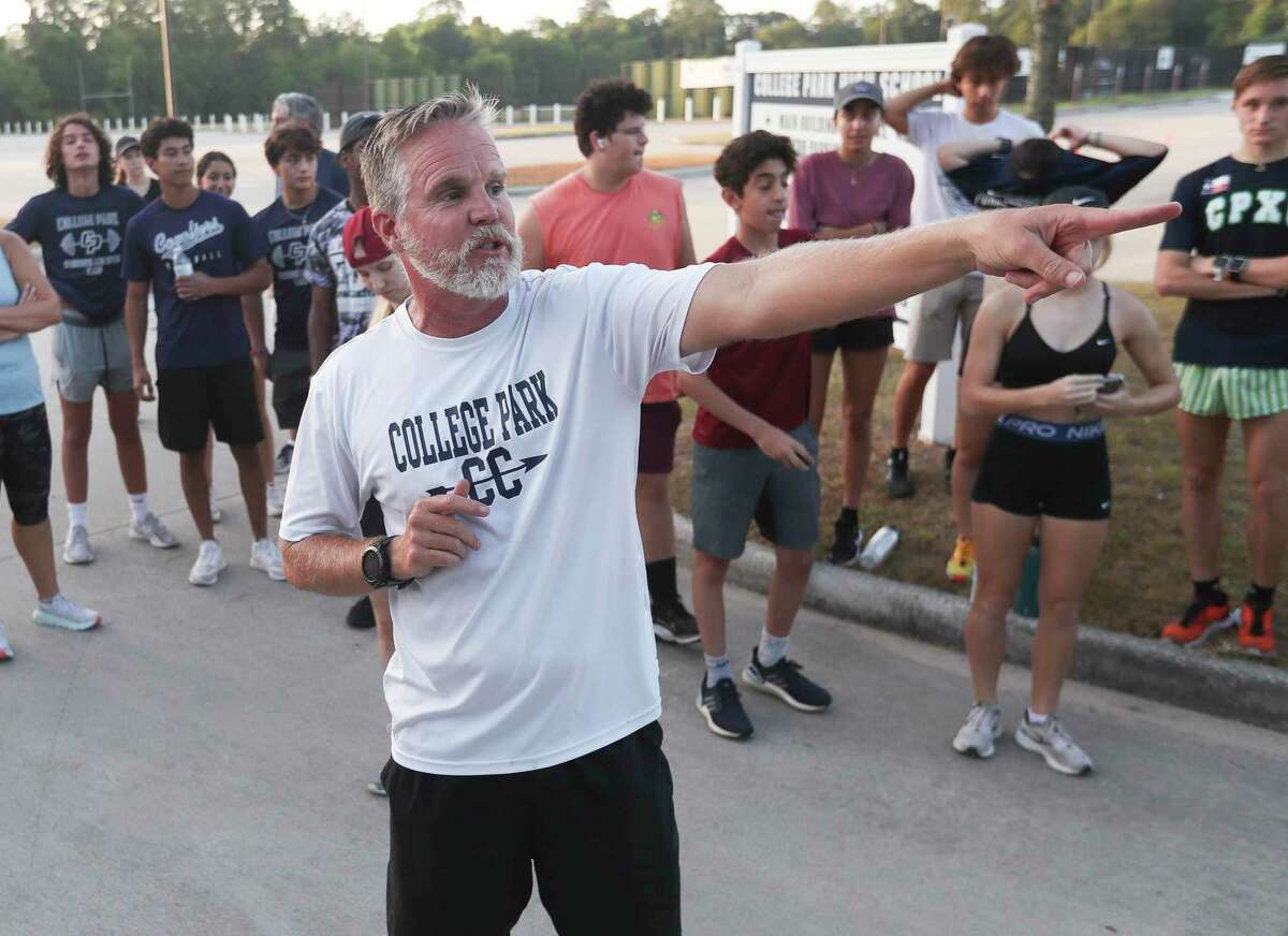 College Park cross country coach Michael Gibson point out the route for the Walk for Uvalde at College Park High School, Saturday, July 23, 2022, in The Woodlands.