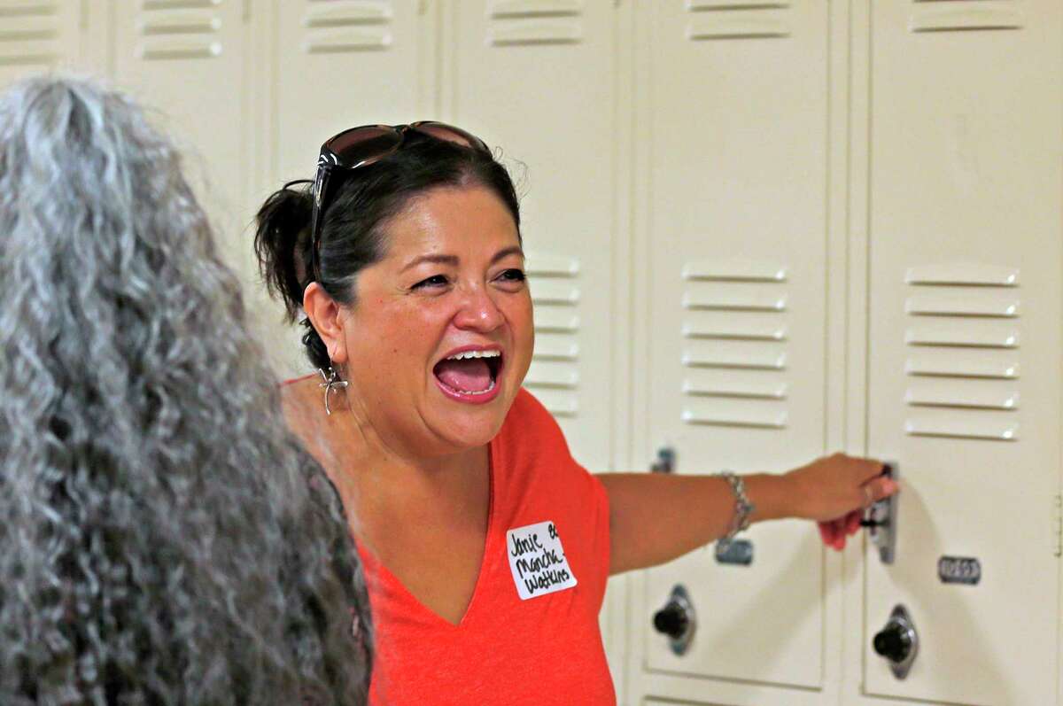 Janice Mancha Watkions, class of 1980, reacts as she find her old locker at Burbank High School during a send-off on Saturday, July 23, 2022.