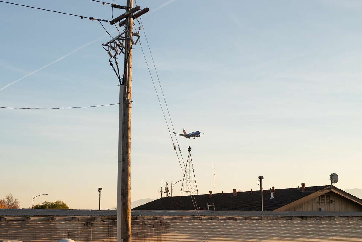FILE PHOTO: A plane prepares to land in San Jose on Dec. 18, 2021.
