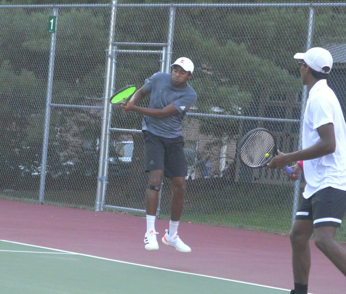 Nishanth Basavareddy returns a serve in the finals of the Doubles Shootout on Saturday at the EHS Tennis Center. 