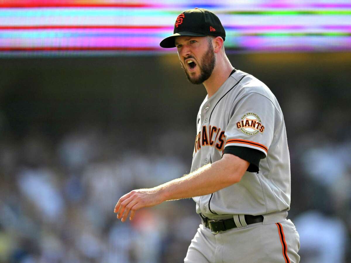 LOS ANGELES, CA - JULY 23: Alex Wood #57 of the San Francisco Giants reacts as he returns to the dugout after giving up back to back home runs in the third inning against the Los Angeles Dodgers at Dodger Stadium on July 23, 2022 in Los Angeles, California. (Photo by Jayne Kamin-Oncea/Getty Images)