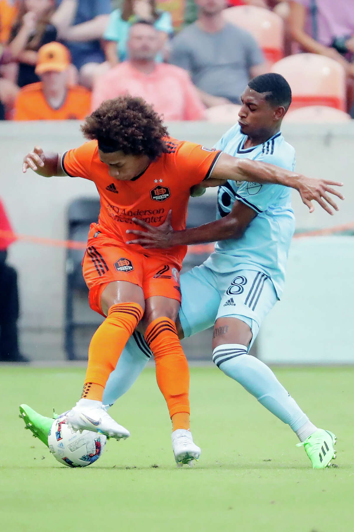 Houston Dynamo midfielder Adalberto Carrasquilla, left, loses the ball on a steal by Minnesota United midfielder Joseph Rosales (8) during the first half of an MLS soccer match Saturday, July 23, 2022, in Houston. (AP Photo/Michael Wyke)