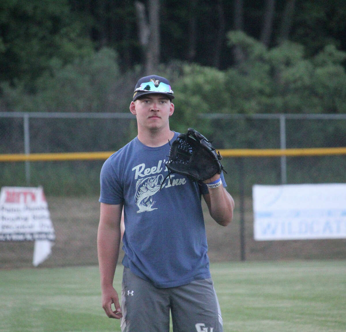 Former standout pither Justin O'Dell gets ready to work out recently at the Evart ball field.