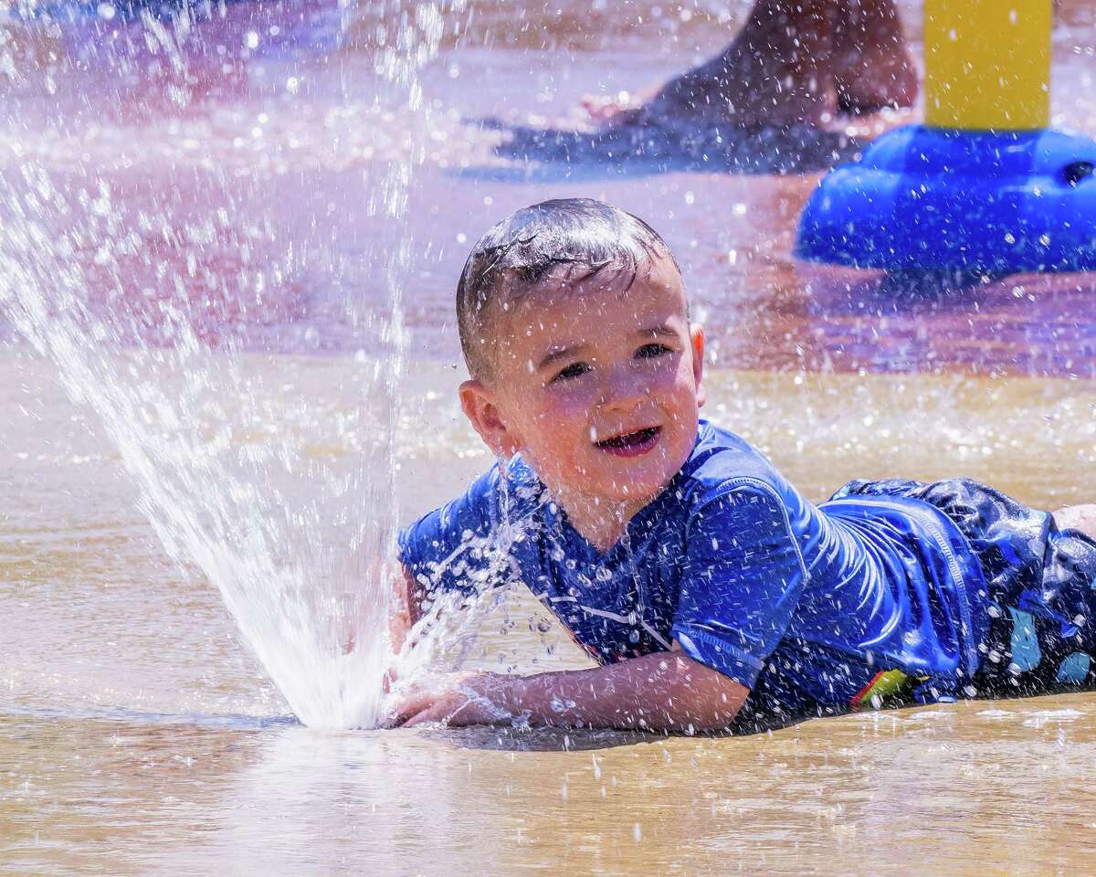 Splash pads, pools and beaches will be popular destinations as oppressive heat moves in Thursday. In this photograph, Noah Levchanko cools off at the Colonie splash pad at the Mohawk River Park on Sunday, July 24, 2022, the end of the region's last heat wave. (Jim Franco/Special to the Times Union)