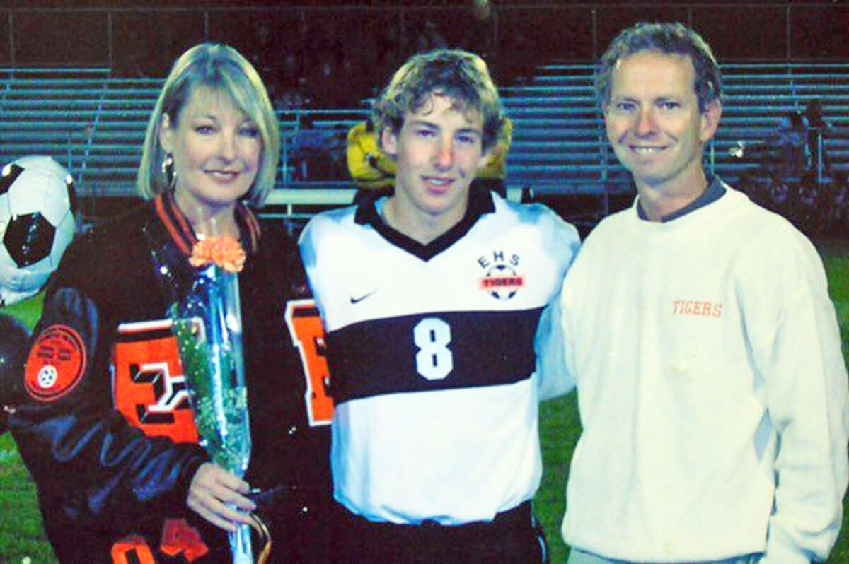 Edwardsville graduate Colin Brinson, middle, with his parents, Patty and Bill, for Senior Night for EHS soccer in 2003.