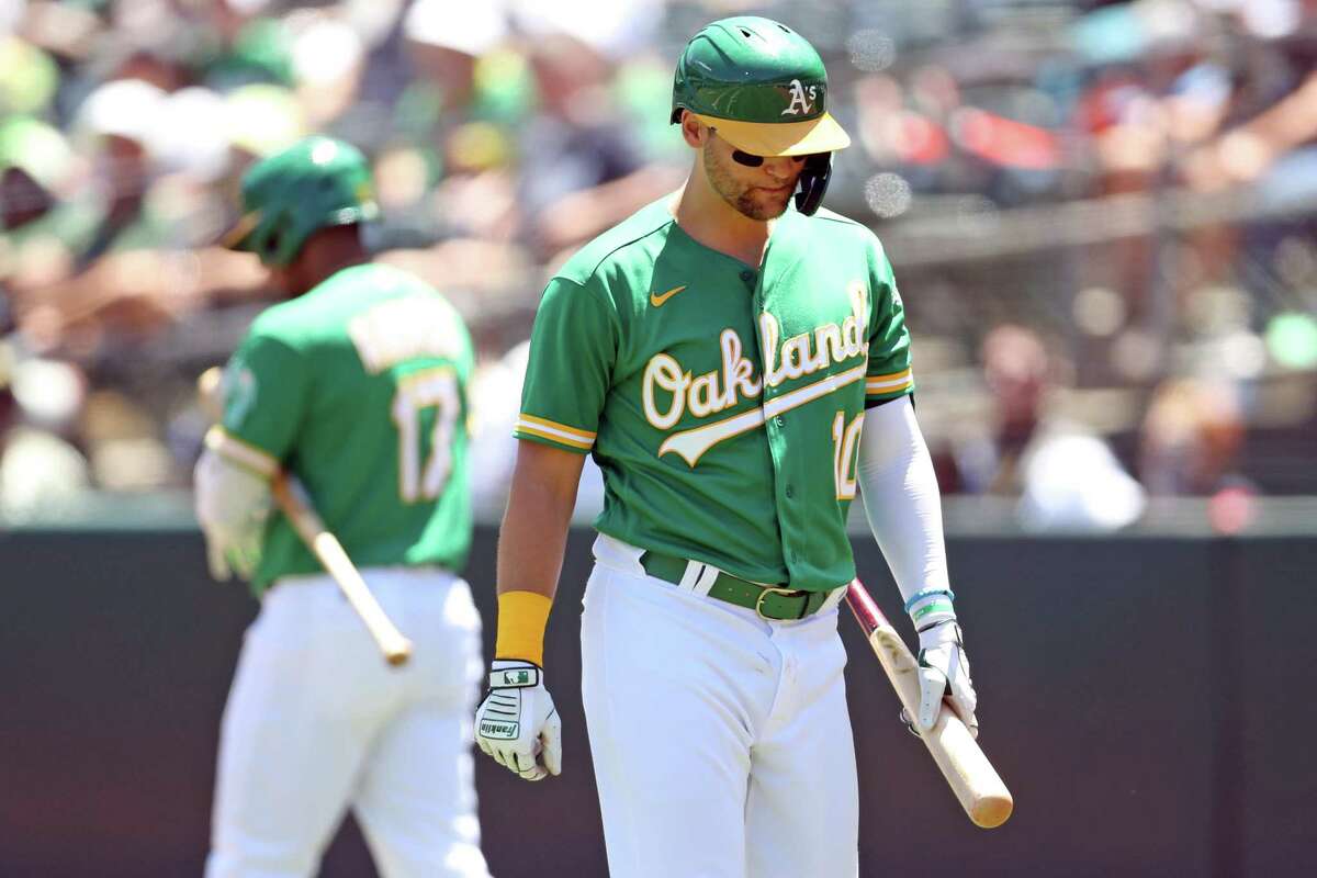Oakland Athletics’ Chad Pinder reacts to being called out on strikes with two men on base in 1st inning against Texas Rangers during MLB game at Oakland Coliseum in Oakland, Calif., on Sunday, July 24, 2022.