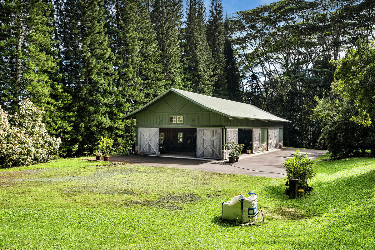 A fully equipped storage barn stocked with machines and tools provides everything necessary to take care of the property.