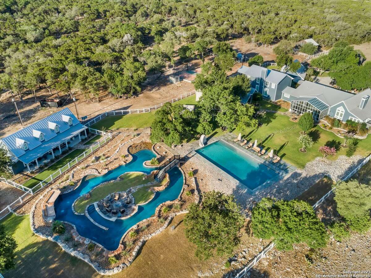 A 5,026-square-foot home with a junior Olympic size swimming pool, resort-style lazy river and swim up bar and fire pit just north of Boerne is on the market for $7.8 million. 