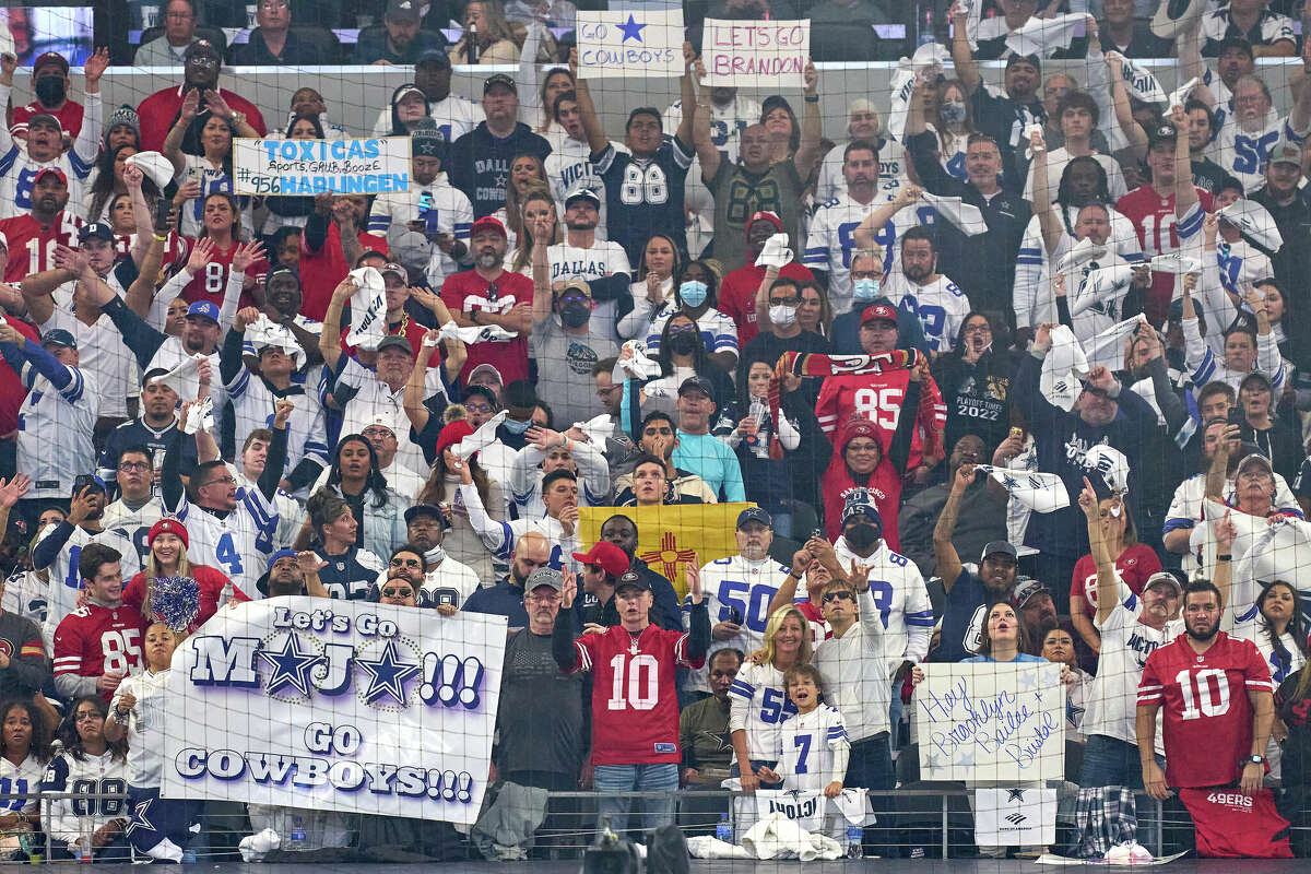 Dallas Cowboys and San Francisco 49ers fans celebrate during the NFC Wild Card game between the San Francisco 49ers and the Dallas Cowboys on Jan. 16, 2022, at AT&T Stadium in Arlington, Texas.
