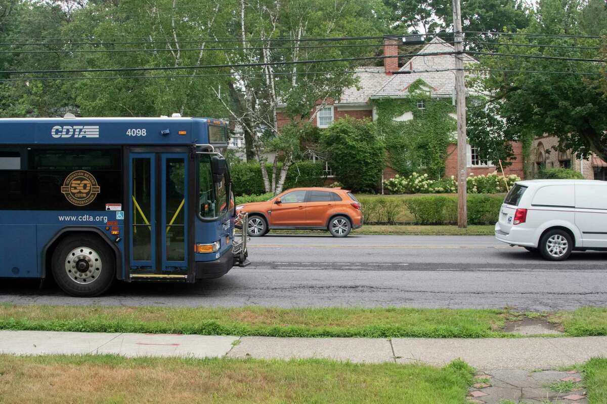 A CDTA bus drives past a bus stop at a proposed bus shelter location along Western Ave. near the intersections of Colonial Avenue and Eileen Street on Monday, July 25, 2022 in Albany, N.Y. Some resident protest convinced CDTA to end the proposal.