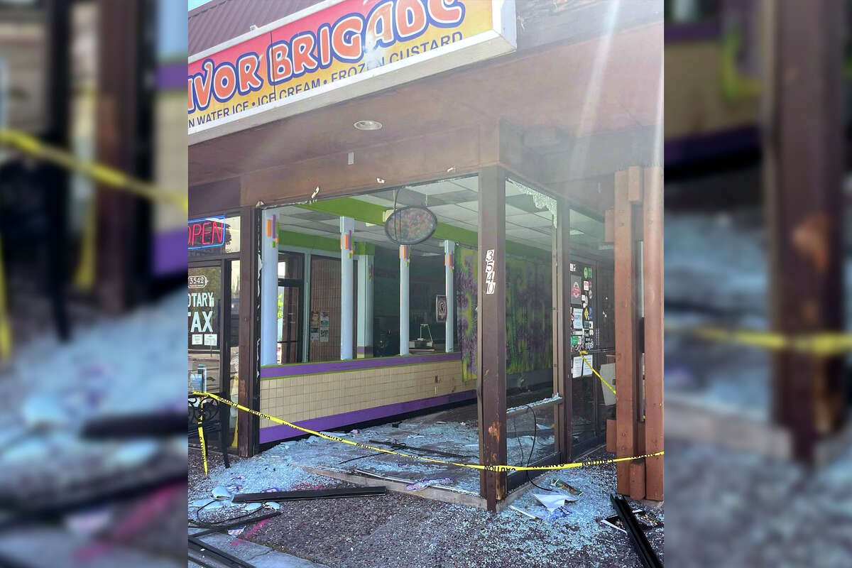 The shop's front windows were shattered as a result of the burglary.