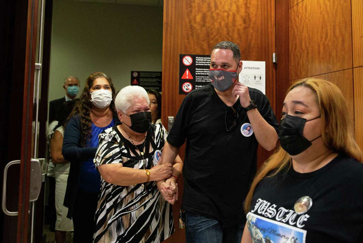 Graciela Quinones, left, and Tito Quinones, the mother and brother of Jessica Quinones, leave 351st District Court after Judge Natalia Cornelio did not set an execution date for death row inmate Arthur Brown, who in 1992 killed several people during a drug bust. , Monday, July 25, 2022, at the Harris County Criminal Courts at Law in Houston.