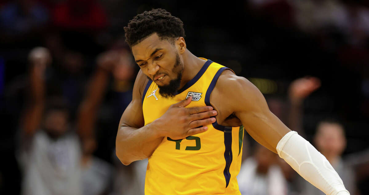 Utah Jazz guard Donovan Mitchell (45) celebrates a made shot during overtime in an NBA game between the Houston Rockets and Utah Jazz on Wednesday, March 2, 2022, at Toyota Center in Houston.