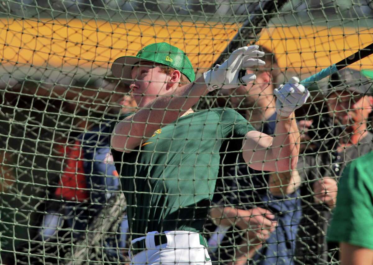 Henry Bolte takes batting practice at the Coliseum in Oakland, Calif., on Monday, July 25, 2022. Bolte is the A’s second round draft pick, outfielder from Palo Alto High School, and the team brought him in today to sign his contract and work out/take batting practice