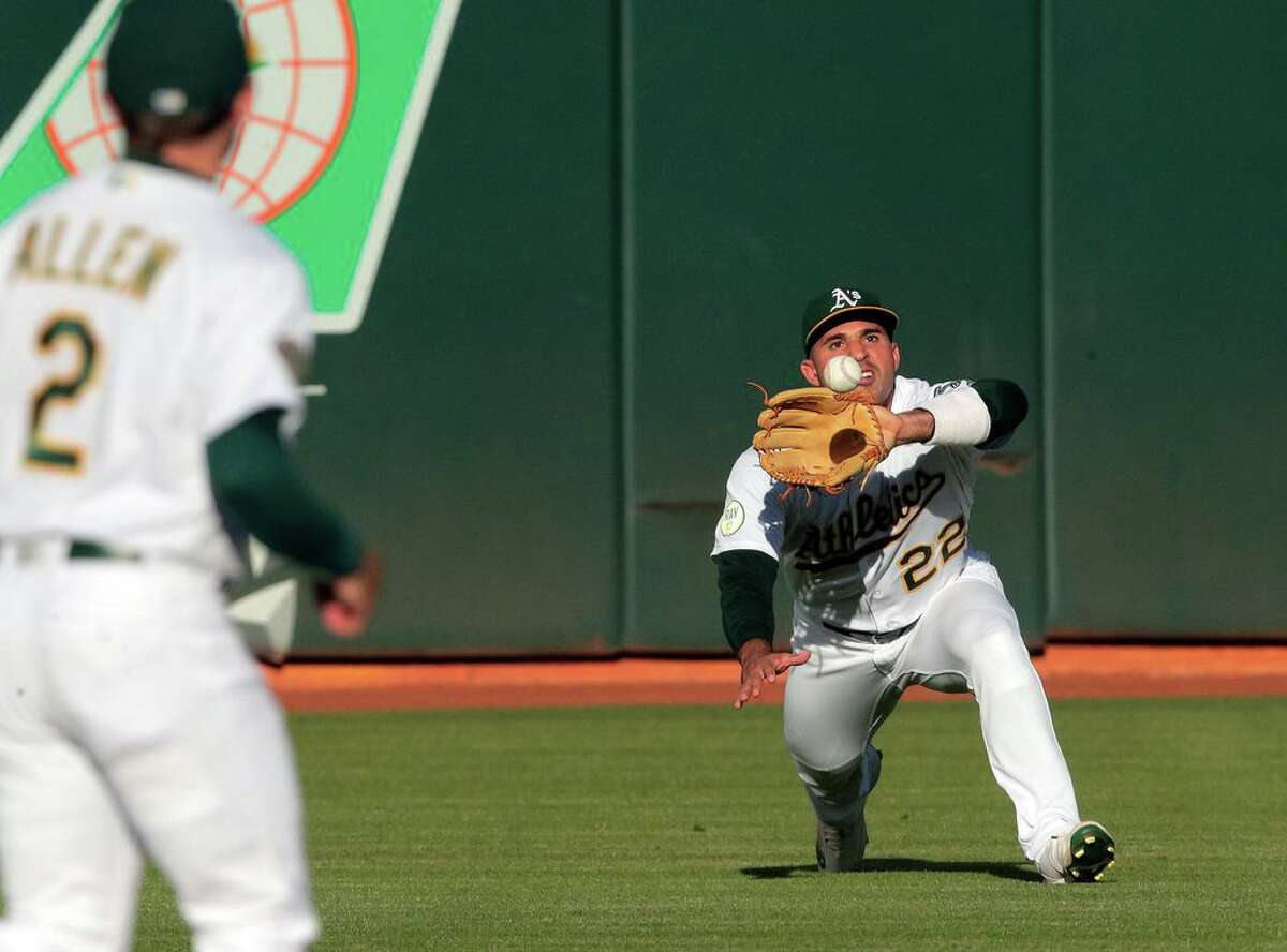 Oakland Athletics center fielder Ramon Laureano cannot catch a single hit  by Houston Astros' Aledmys Diaz during the fifth inning of a baseball game  in Oakland, Calif., Friday, July 8, 2022. (AP