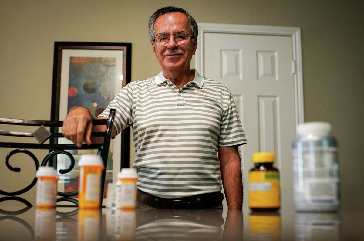 Enrique Barrientos 69, poses for a portrait with four of his heart medications and two vitamins he takes Thursday, July 21, 2022, at his home in Katy. He suffered a heart attack in early April and takes several medicines as a result. Excessive heat can interact negatively with certain medicines, making people more susceptible to dangerously low blood pressure, dehydration and exhaustion.