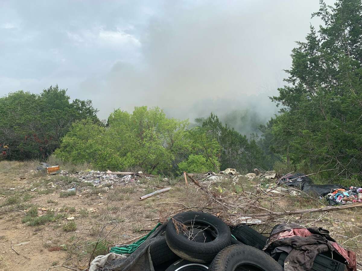 An illegal dump near Onion Creek has caught fire twice in the past week.